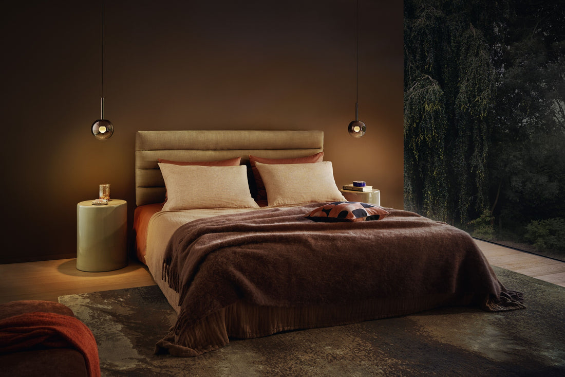 Occhio Luna sospeso pendant luminaire in a serene bedroom