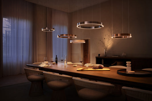 Occhio Mito sospeso pendant luminaires above a modern dining table