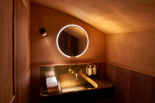 Occhio Mito sfera mirror luminaire in a luxury bathroom